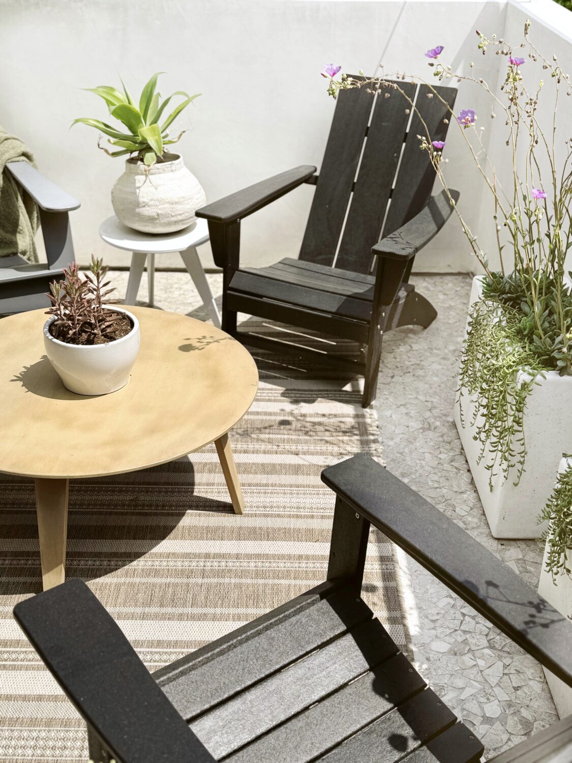 tips on how to refresh your outdoor space by adding greenery and textiles 