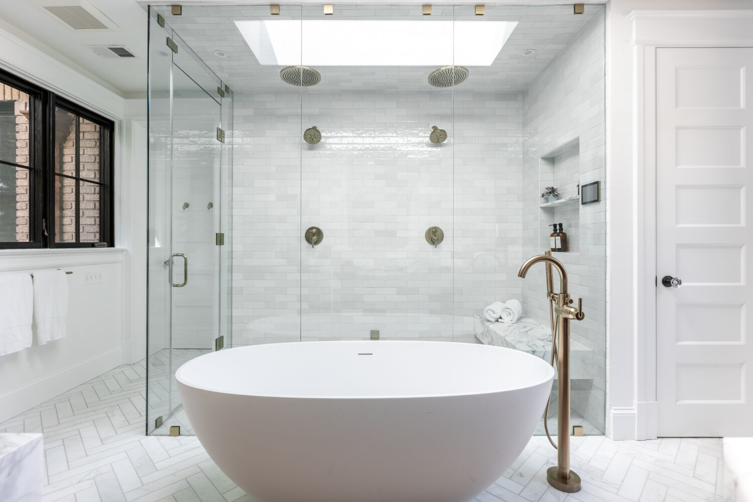 historic primary bathroom remodel and reveal. Marble floors and freestanding tub. 