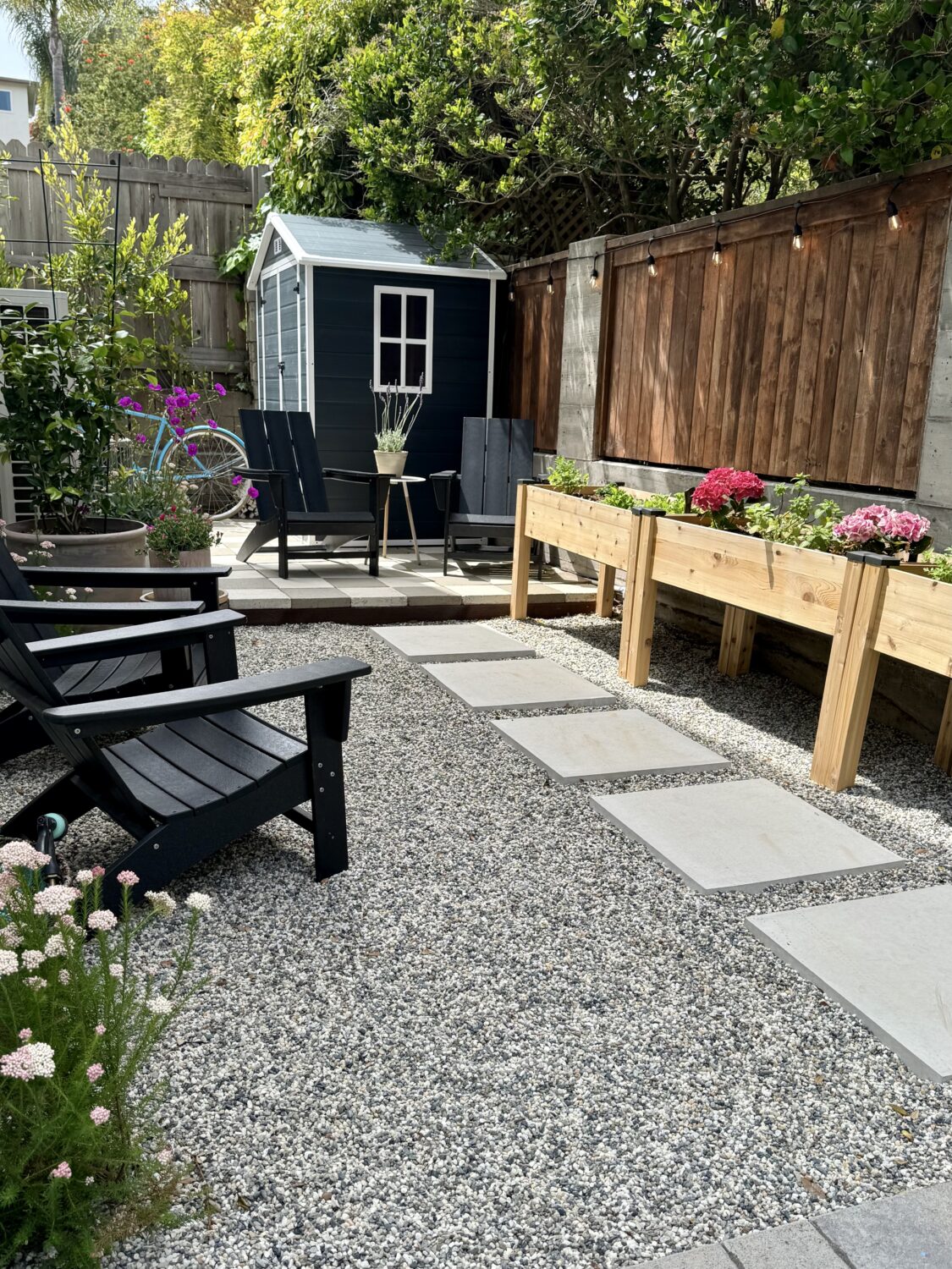 our backyard glow up with a garden and pavers
