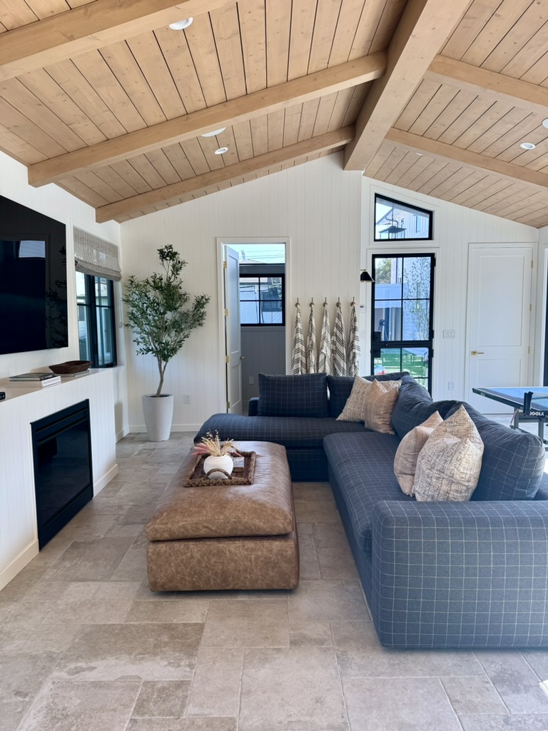 Open concept living room with custom fireplace surround